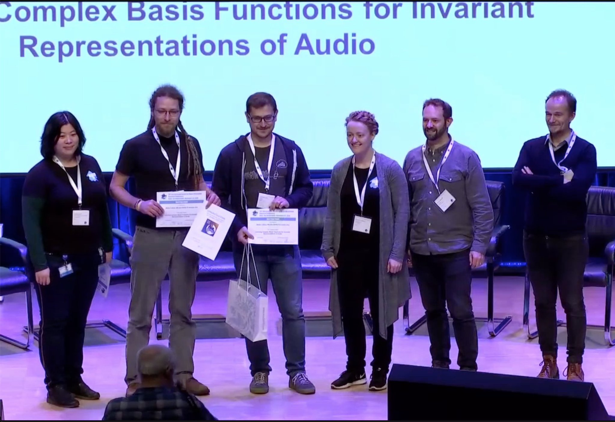 Stefan Lattner (second from left) receiving the Best Paper Award at ISMIR 2019